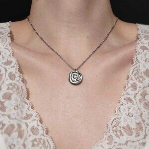 Gothic abstract hypnosis swirly necklace with a small silver chain